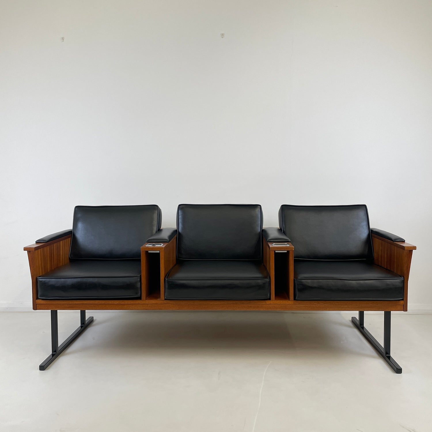 This is an up close shot of a Solid Teak Piece of Furniture with a wool Blue cushioning and upholstery. See more Teak Midcentury Furniture on our website