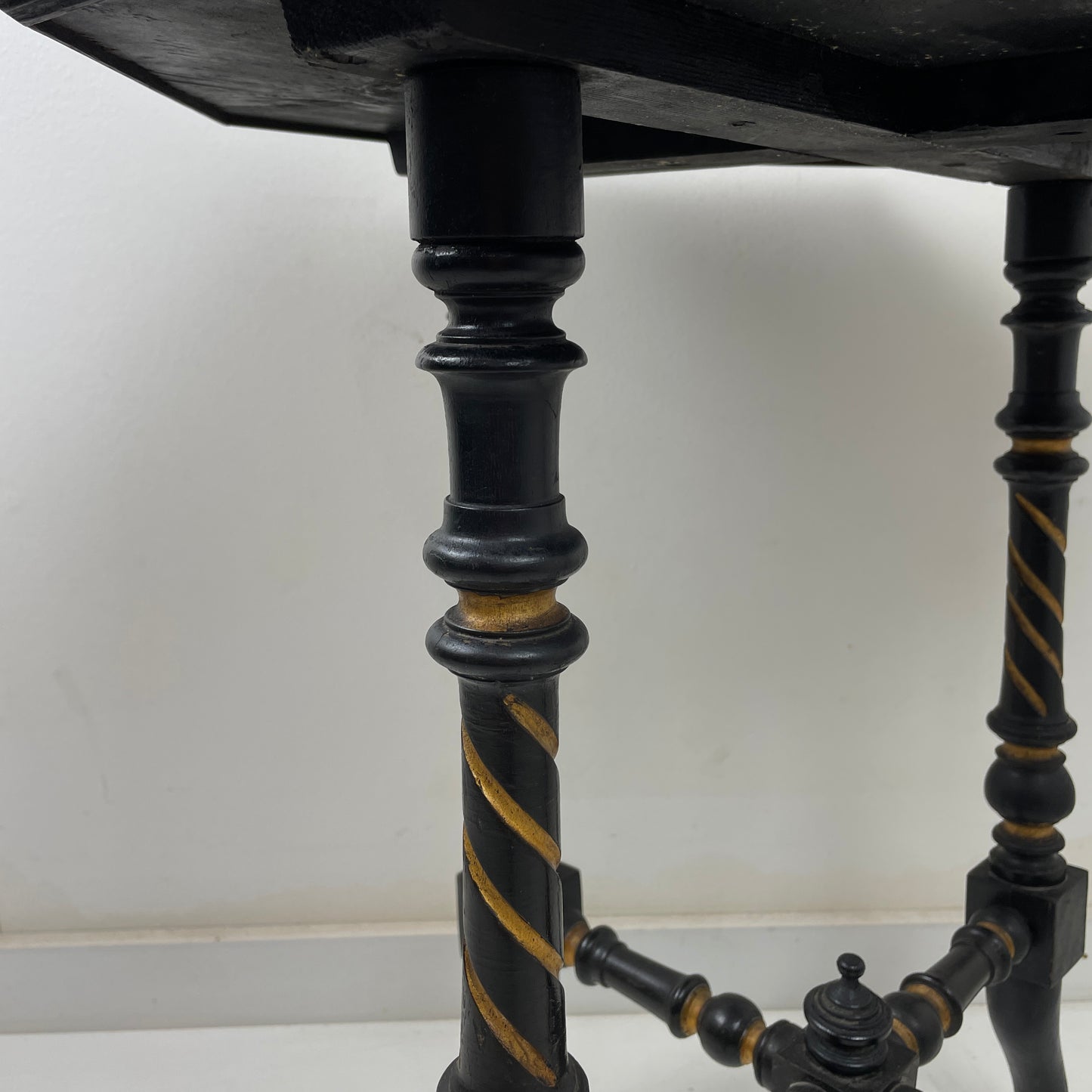 EBONISED SIDE TABLE ON CASTORS