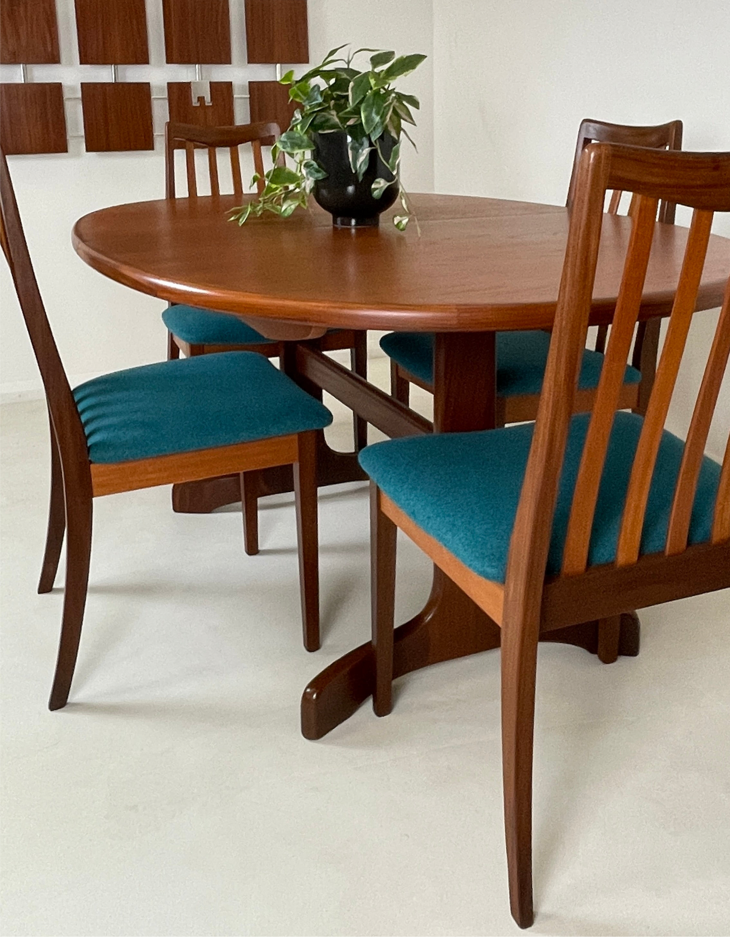 the gplan table is put back to its smaller size with the matching 4 chairs available to buy separately shown again