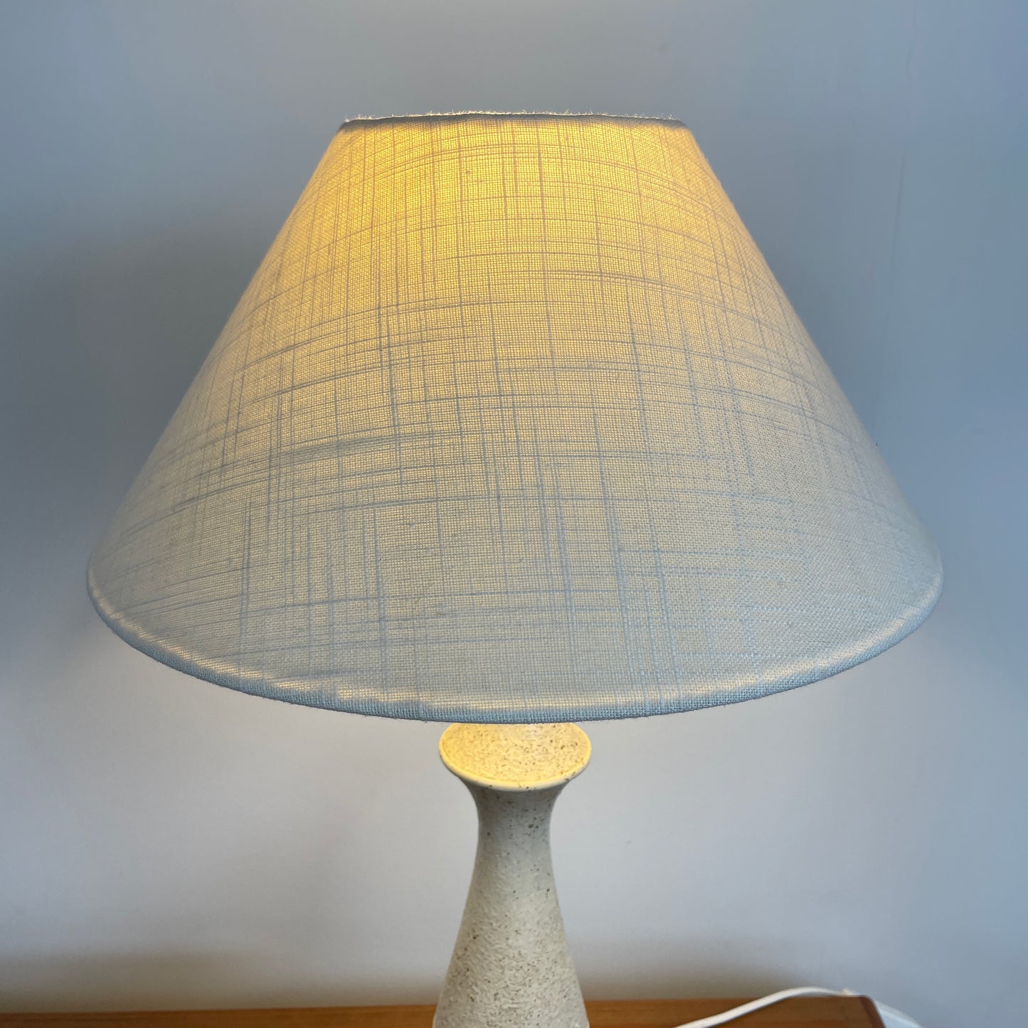 The bespoke shade is pictured as a close up image, you can see the light shining through the fabric, the fabric is strong high quality in a sublte shade of powdery white/blue. Taken against a white background