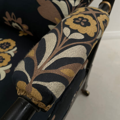 ANTIQUE BLACK EBONISED LIBRARY CHAIR ON CASTORS