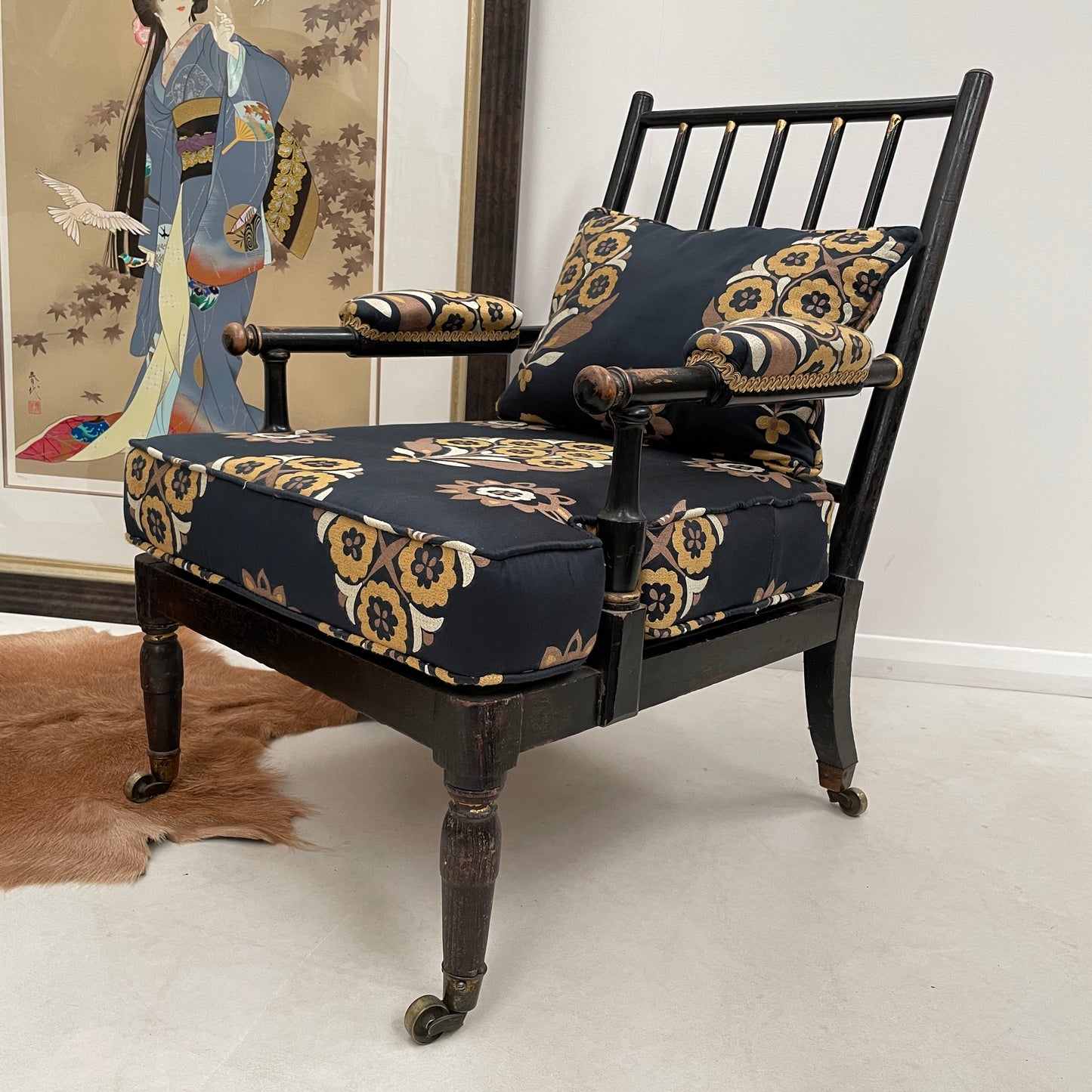 ANTIQUE BLACK EBONISED LIBRARY CHAIR ON CASTORS