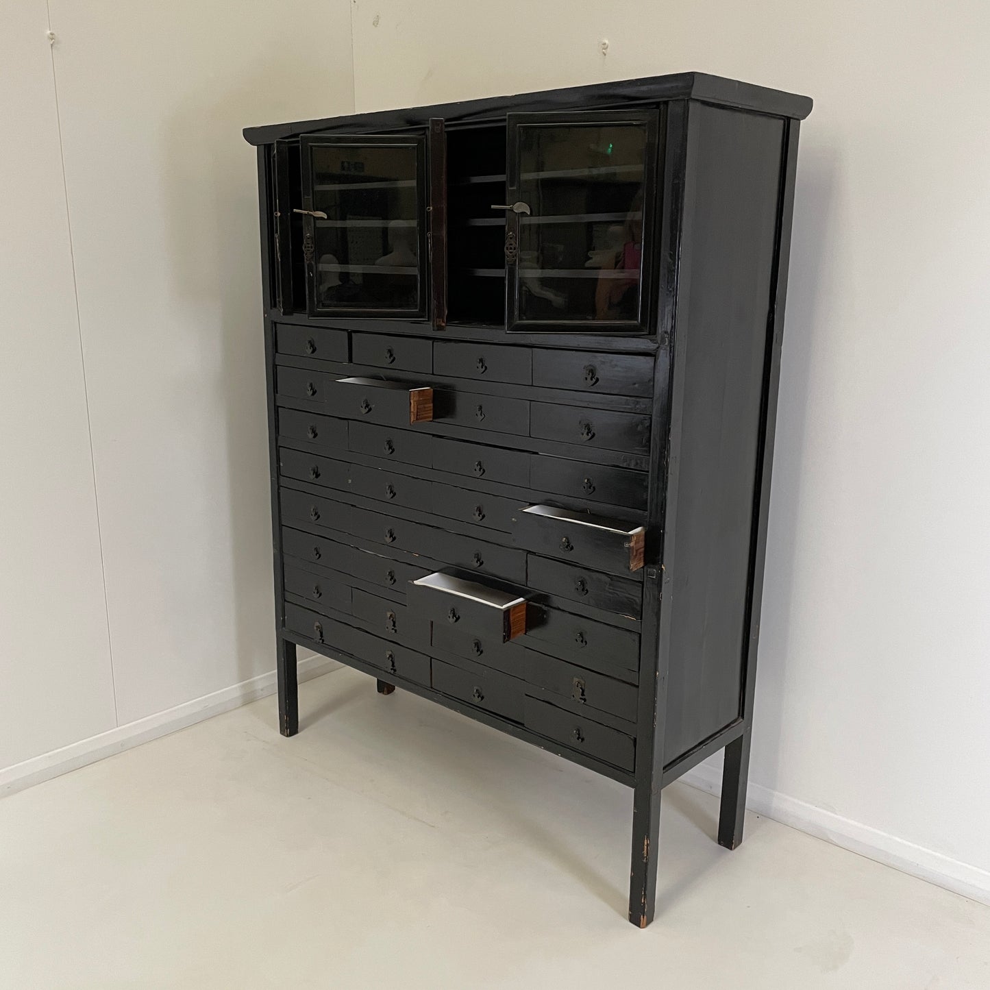 EBONISED CHINESE APOTHECARY CABINET WITH GLAZED DOORS