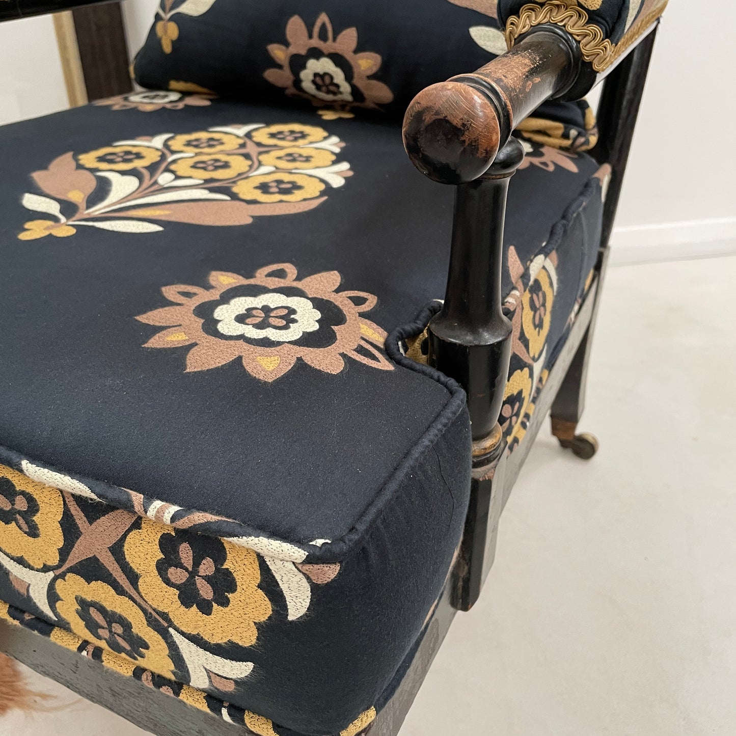 ANTIQUE BLACK EBONISED LIBRARY CHAIR ON CASTORS