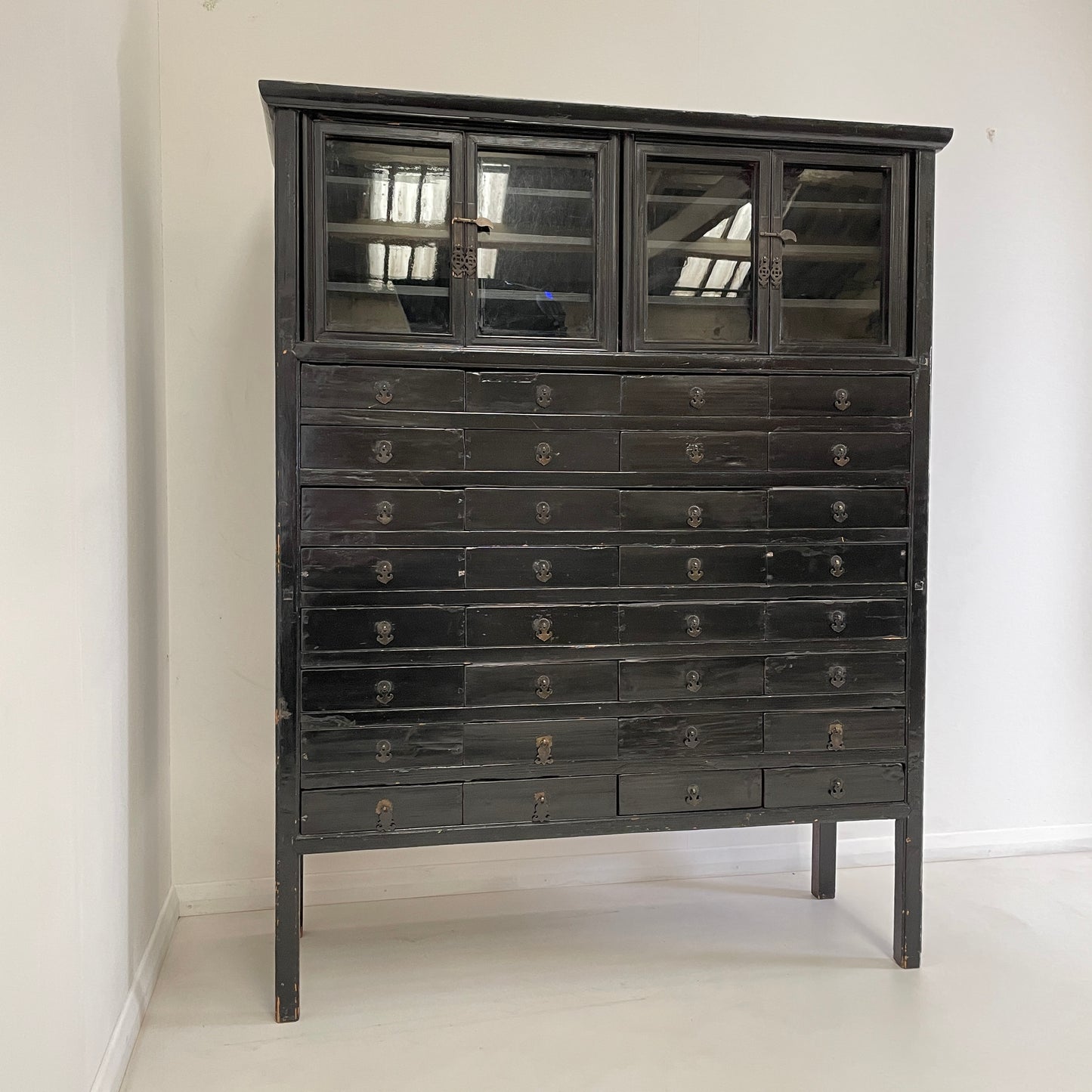 EBONISED CHINESE APOTHECARY CABINET WITH GLAZED DOORS